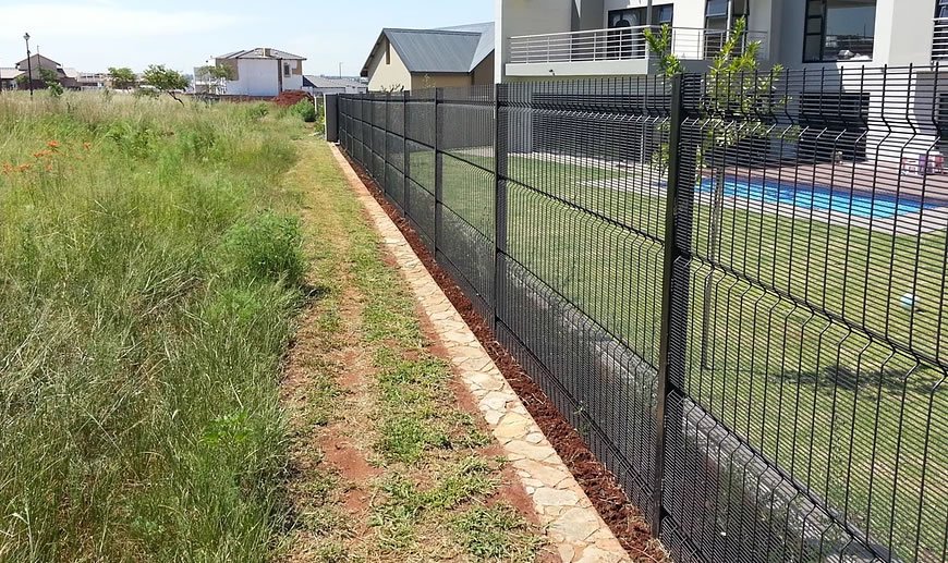 Black high security clearview mesh fence near a residential garden and swimming pool