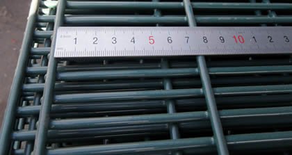 Ruler measuring the 76.2 mm pitch on a 358 security fence panel