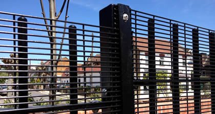 Black 358 welded security mesh panels beside matching steel posts