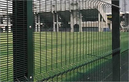 3510 welded mesh security fence with V bends beside a grassland area