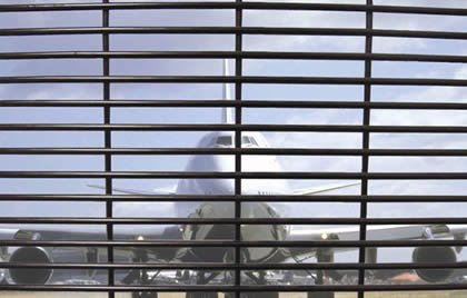 Black 3510 high security welded fencing shown in a transport perimeter setting