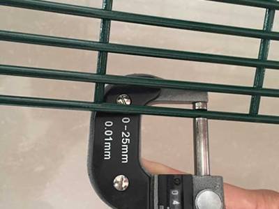 Digital measuring instrument checking the wire diameter of a 358 security fence panel