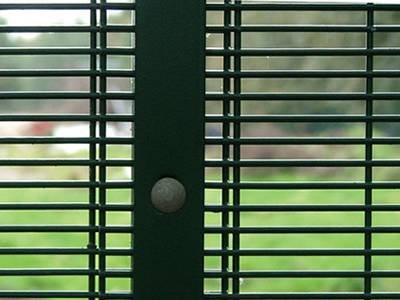 Two green 358 fence panels joined with overlapping edges and a steel clamp bar
