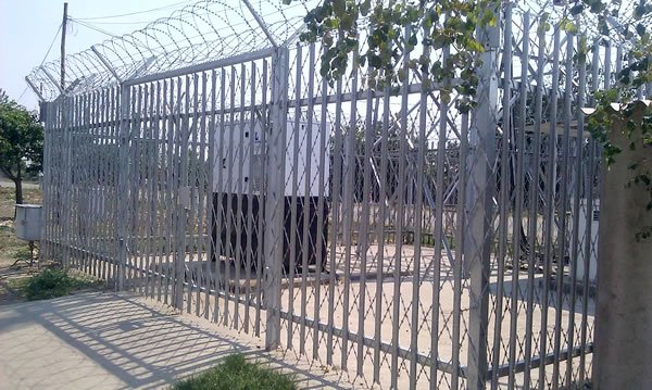 Triple pointed steel palisade security fence with perimeter topping