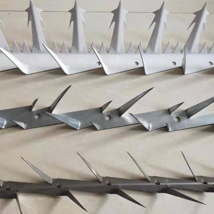 Original BMP pointed security wall spike strips showing steel teeth and surface finish