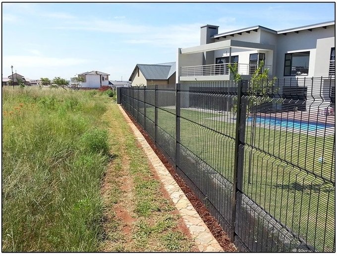 Clear view fence reference showing finished security mesh panel for residential perimeter installation