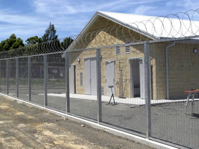 Industrial 358 security mesh fence with razor wire topping around factory buildings