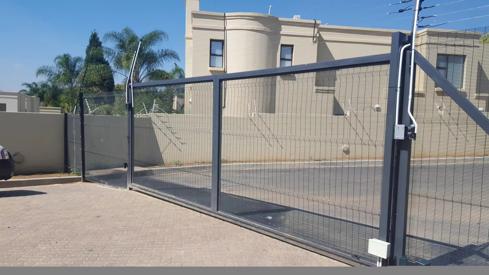 High security welded mesh fencing with pedestrian and vehicle gate arrangements